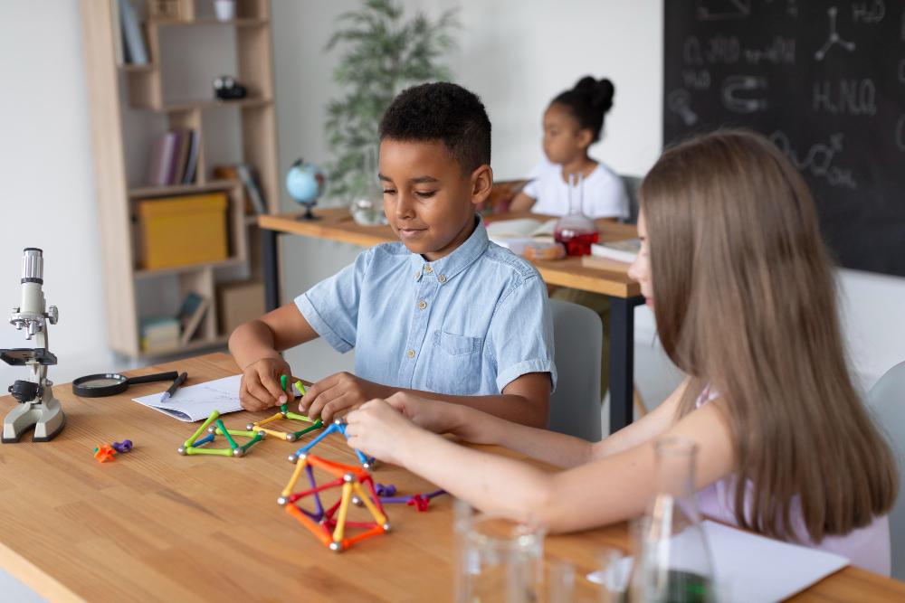 Children building and creating during Exploration Fridays at iBis