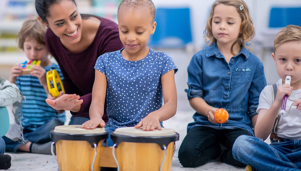 ibis-children-playing-musical-instruments image Teacher with children playing musical instruments
