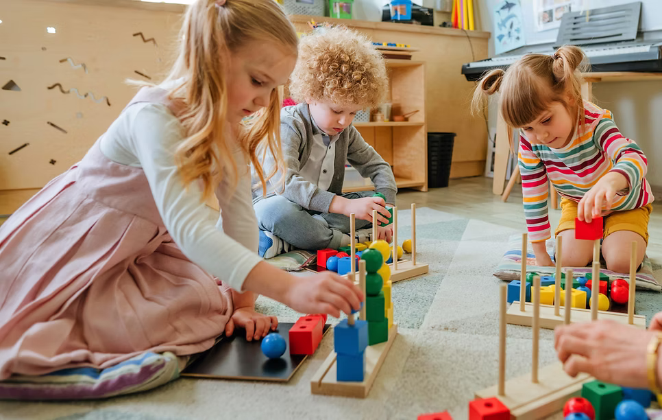 ibis-children-playing-with-blocks image Teacher with children playing with blocks